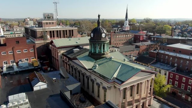 Aerial establishing shot of Lancaster City, Pennsylvania, USA, aerial skyline view of courthouse, churches during magic hour