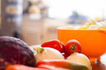 fresh vegetables on the table - chili pepper, onion, tomato and purple cabbage in the kitchen - vegetarian food, healthy food