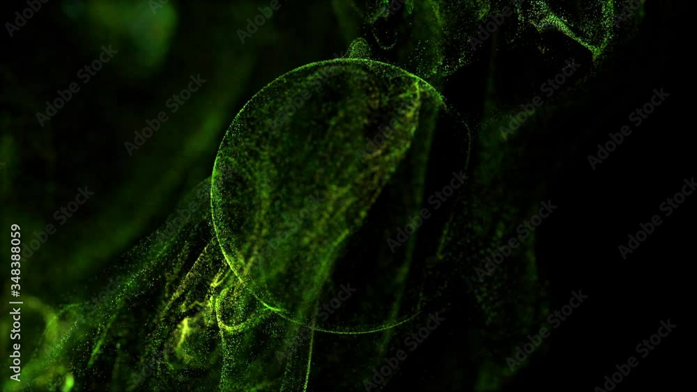 Poster stream of green luminous particles underwater on black background runs into a spherical field, place