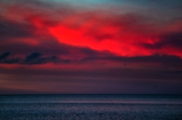 Naklejka na ściany i meble sunset over the sea, sky, ocean, clouds, water, beach, summer, dramatic, red, beautiful, coast, blue, intense, seascape
