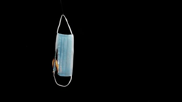 Slow-motion of a burning face mask, four times slowed down