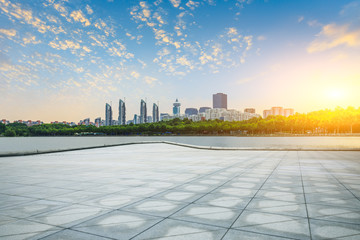 Empty square floor and city skyline with buildings in shanghai at sunset,China.