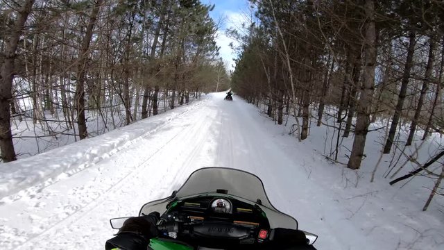 Snowmobiling POV Through Trees