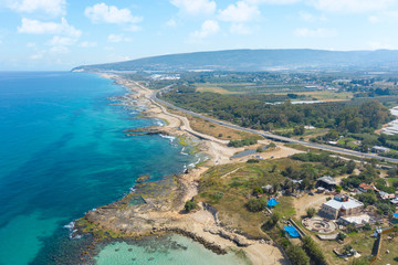 The Israeli coast of the Mediterranean Sea . Near the Banana Beach. Aerial shot in the daytime. 