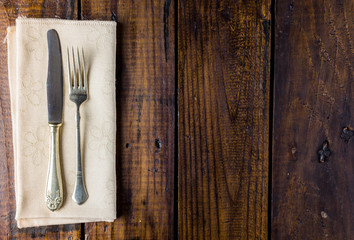 Cutlery set on a rustic wooden table. Fork and knife. Food concept. Copy Space