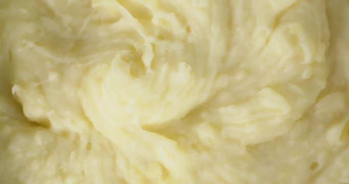 Mashed potatoes rotates slowly. Macro background.