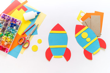 Rocket craft made of cardboard and paper. Recycling children's creativity.