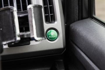 Obraz premium Car eco fuel economy button ignition remote starter. Car dashboard
