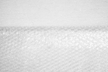 white bubble wrap background, used plastic wrap