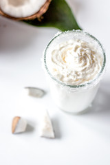 cocktail with coconut on white background