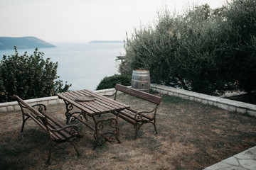 bench and table on the background of the sea