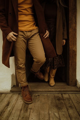 couple in autumn clothes walks outside