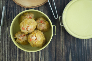 Steamed shrimp dumplings served in tiffin box