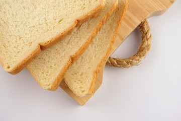  Serving white bread with chocolate ceres on a wooden tray.