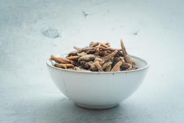 Crispy sweet dried small anchovy fish in bowl