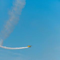 Airplanes on airshow. Aerobatic team performs flight at air show