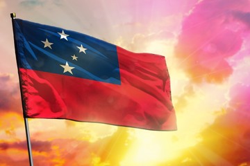 Fluttering Samoa flag on beautiful colorful sunset or sunrise background. Success concept.