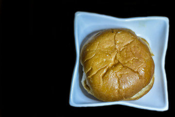 indian famous ban makkhan on a white plate with black background, Indian Food