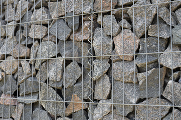 background of stones in a metal grid