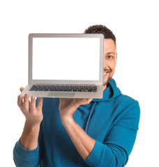 Handsome man with laptop on white background
