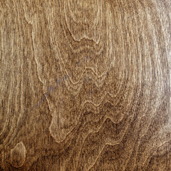 dark lacquered veined wood surface top view, brown background texture