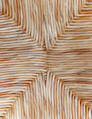 light brown cross shaped wicker close up, seamless natural background