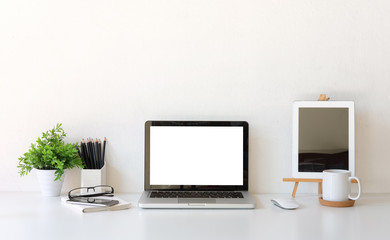 Office desk Workspace stuff with notepad, laptop and coffee cup mouse notepad shot.
