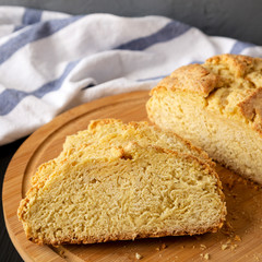 Homemade Irish Soda Bread on a black background, side view. Close-up.