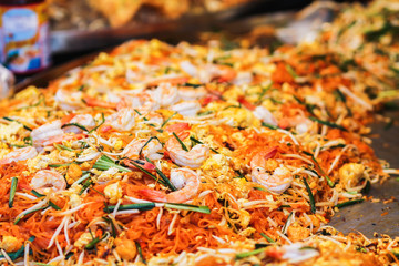 Blurred images of Pad Thai menu,Pad Thai is a ready-to-eat food that is popular on the Walking Street or Street Food in Thailand because Pad Thai is easy to carry and easy to eat when walking.