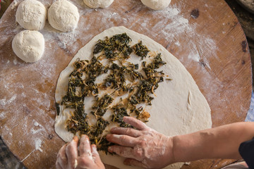 woman fills in to turkish gozleme
