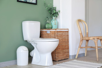 Interior of modern bathroom with floral decor