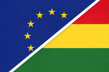 European Union or EU vs Bolivia national flag from textile. Symbol of the Council of Europe association.