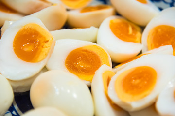 Peeled boiled eggs in both whole and half shape, healthy boiled eggs.