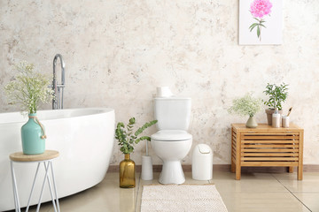 Interior of modern bathroom with floral decor