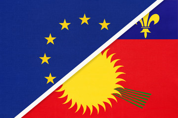 European Union or EU vs Guadeloupe national flag from textile. Symbol of the Council of Europe association.