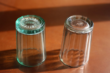 Two faceted glasses turned upside down.