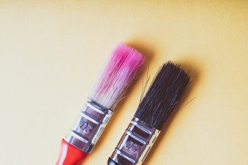 red and black brush on a yellow background