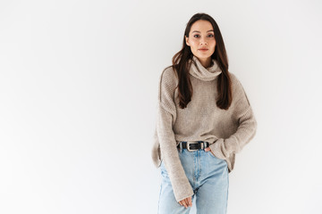 Image of pleased asian woman posing and looking at camera