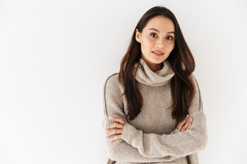 Image of pleased asian woman posing and looking at camera
