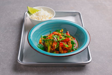 Colorful Asian meat and vegetable dish. Sweet and sour pork and mixed vegetable delicacy. Tasty dinner.