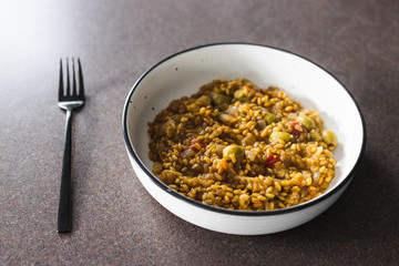 plant-based food, vegan farro with Mediterranean vegeteables and olives with Moroccan spices