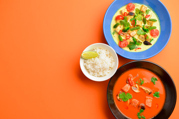 Asian food. Dish with noodles, chicken stir fry and vegetables ingredients with spices, sauces, sushi.