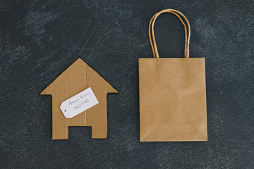 helping businesses after the global lockdown caused by covid-19, shopping bag and house icon with Shop from home message