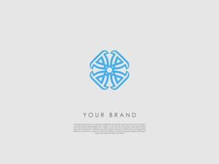 a blue round-edged diamond-shaped business logo which looks like a flower
