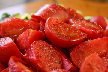 pieces of tomatoes with salt and pepper sprinkled
