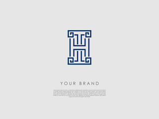 a blue business logo which represents an ancient column and has the letters t and h