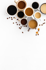 Many cups of coffee on white desk top view space for text