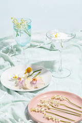 Delicate decorative flowers on plates. Creative concept of table serving and healthy eating