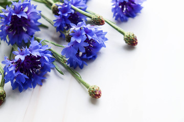 greeting card. a bouquet of blue cornflowers and an envelope. space for text. invitation