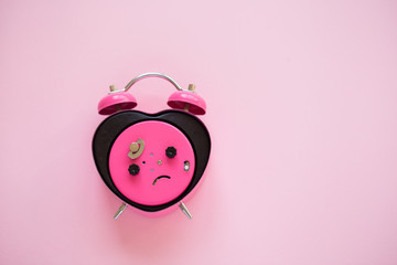 Pink heart shaped alarm clock.